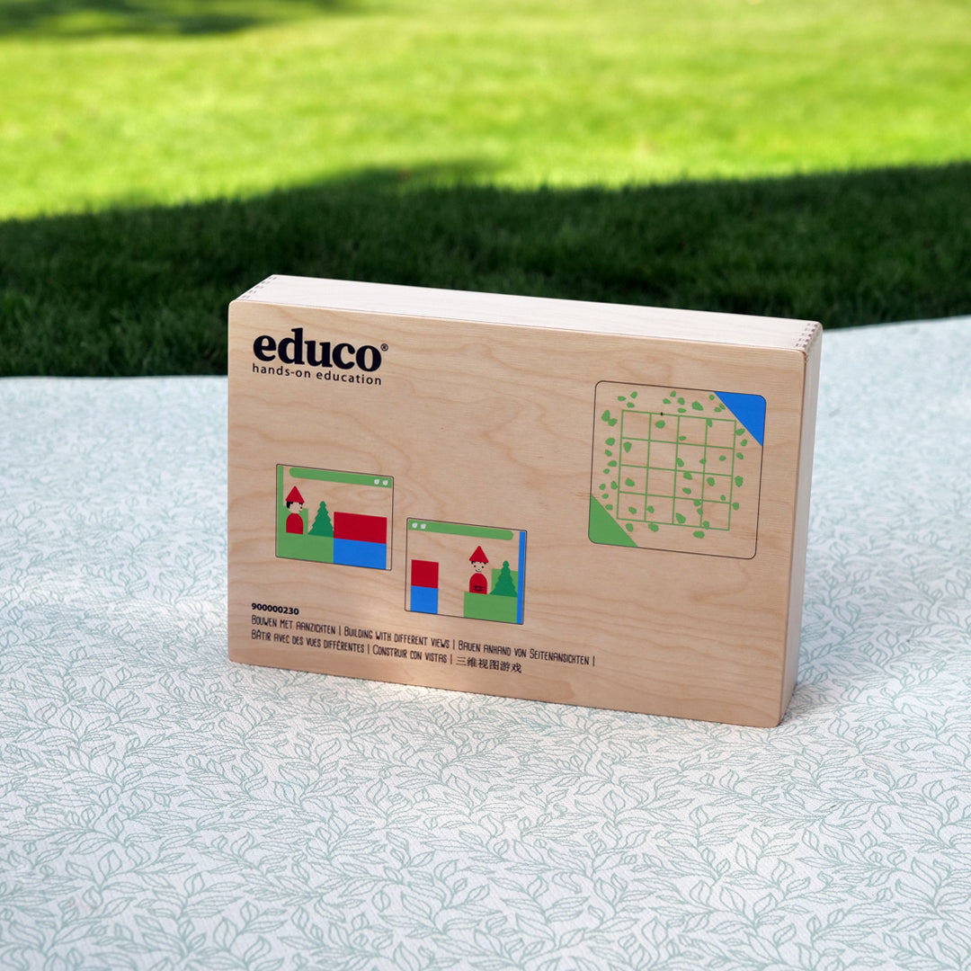 Drewniana gra edukacyjna 'Nauka Perspektyw' od marki Educo, w kolorowym opakowaniu, wspierająca rozwój umiejętności poznawczych, społecznych i emocjonalnych poprzez zabawę oraz naukę różnych perspektyw.